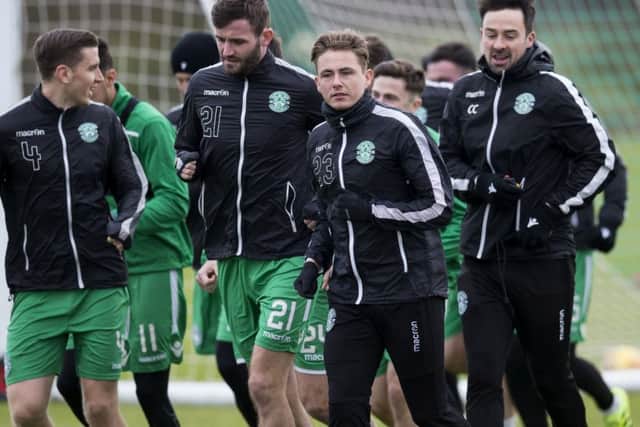 Jason Naismith and Scott Allan lead the Hibs players at training ahead of Wednesday night's game against Ross County. Picture: Bruce White/SNS
