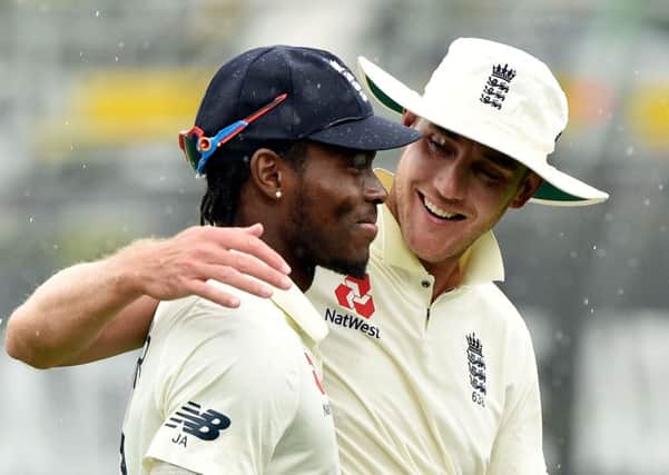 England's pacemen Jofra Archer and Stuart Broad leave the field as rain stops play on the fifth day of the second Test. Picture: Peter Parks/AFP via Getty Images