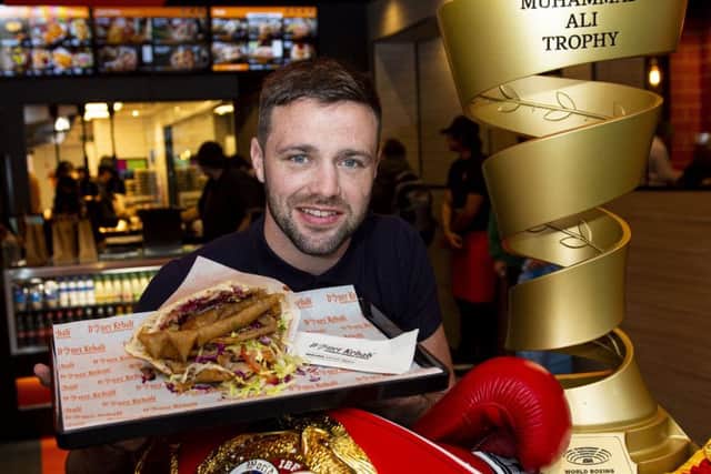 Josh Taylor took his boxing trophies along to the opening of German Doner Kebab on Lothian Road in Edinburgh. Picture: Ross MacDonald / SNS