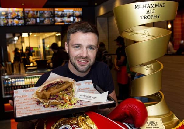 Josh Taylor took his boxing trophies along to the opening of German Doner Kebab on Lothian Road in Edinburgh. Picture: Ross MacDonald / SNS
