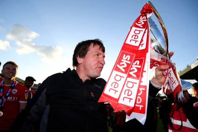 Daniel Stendel celebrates winning promotion to the Championship with Barnsley last season.