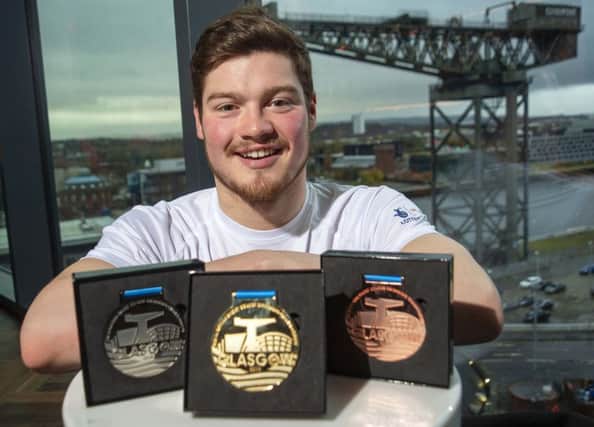 Scott McLay with the official medals for Glasgow 2019, the LEN European short-course championships. Picture: Bill Murray/SNS