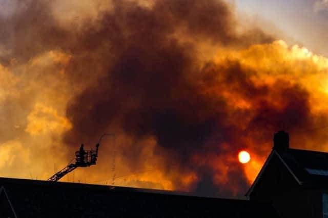 Firefighters tackling the blaze.