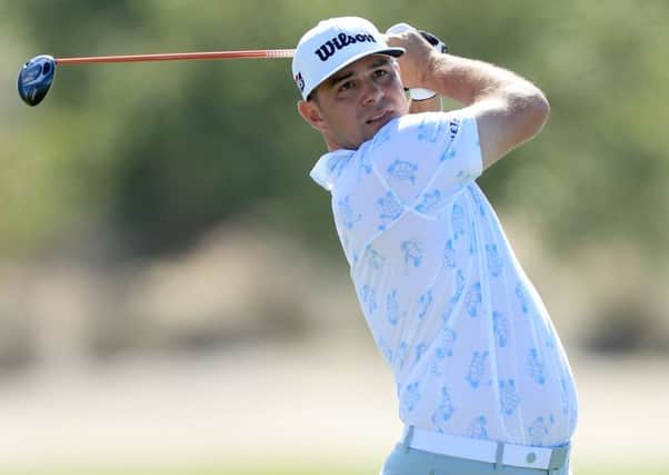 Gary Woodland, with turtles adorning his shirt, plays his second shot on the third hole during the first round of the 2019 Hero World Challenge in Nassau. Picture: David Cannon/Getty Images