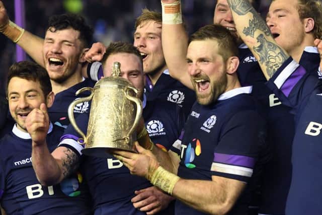 John Barclay, centre, and his Scotland team-mates celebrate with the Calcutta Cup. Picture: Gary Hutchison/SNS