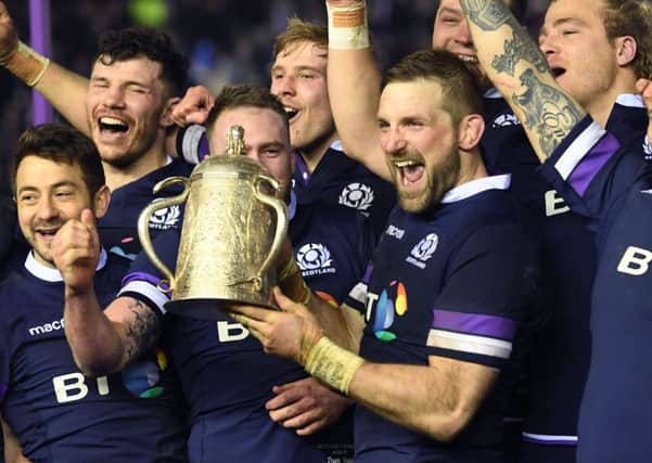 John Barclay, centre, and his Scotland team-mates celebrate with the Calcutta Cup. Picture: Gary Hutchison/SNS