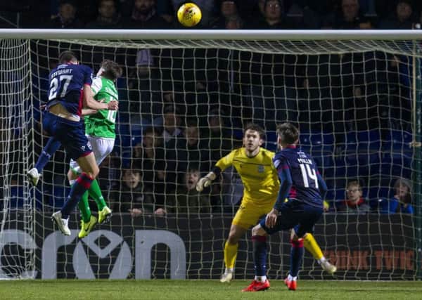 Ross Stewart rises highest to put Ross County ahead against Hibernian with his second goal of the game. Picture: Bruce White / SNS
