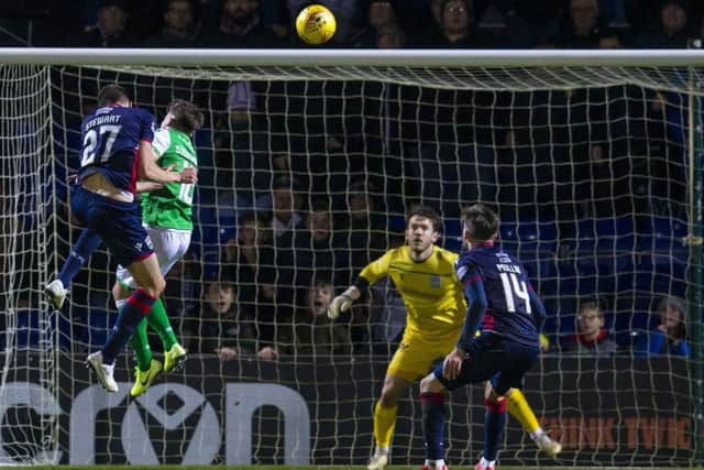Ross Stewart rises highest to put Ross County ahead against Hibernian with his second goal of the game. Picture: Bruce White / SNS