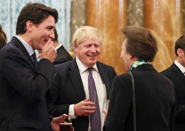It's not know what they were talking about at this precise moment, but Boris Johnson, Justin Trudeau and Princess Anne seem to have found it rather funny (Picture: Yui Mok/PA Wire)