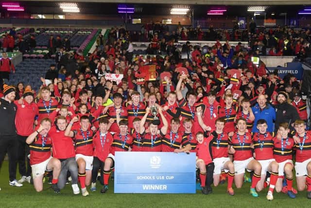The Stewart's-Melville U18s celebrate their cup victory. Picture: Paul Devlin/SNS/SRU