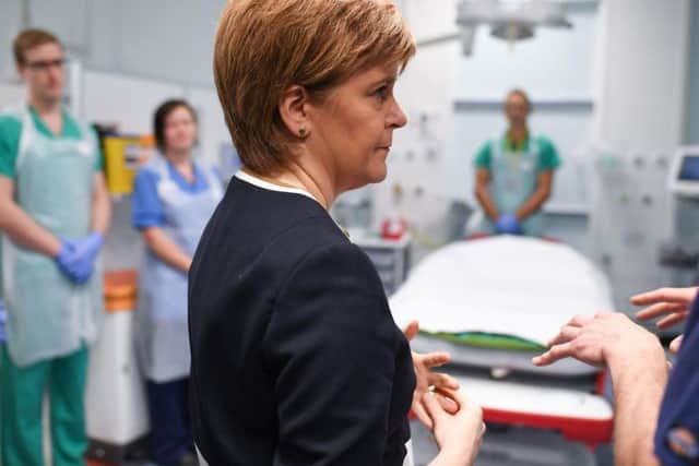 First Minister Nicola Sturgeon visits a hospital. Picture: PA