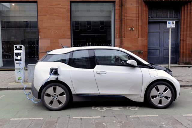 Pure battery electric cars, such as this BMW i3, now command a 3 per cent share of the market. Picture: John Devlin