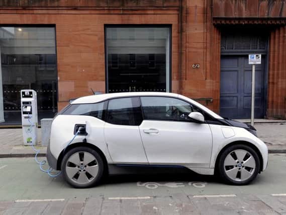 Pure battery electric cars, such as this BMW i3, now command a 3 per cent share of the market. Picture: John Devlin