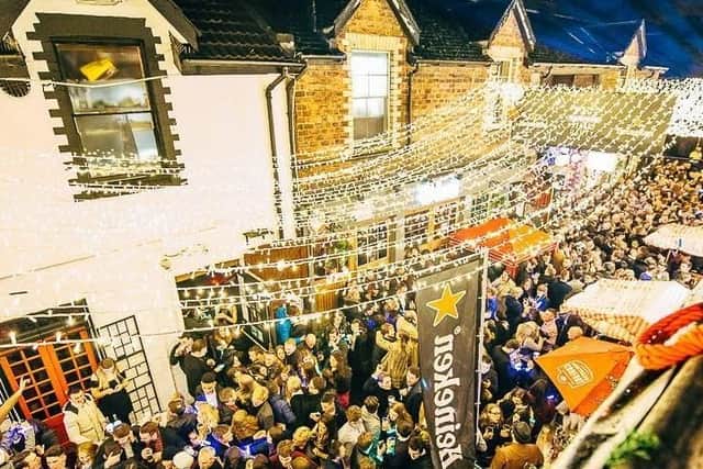 Revellers enjoy Glasgow's Ashton Lane Street Party under glittering fairy lights. (picture: Ashton Lane Street Party)