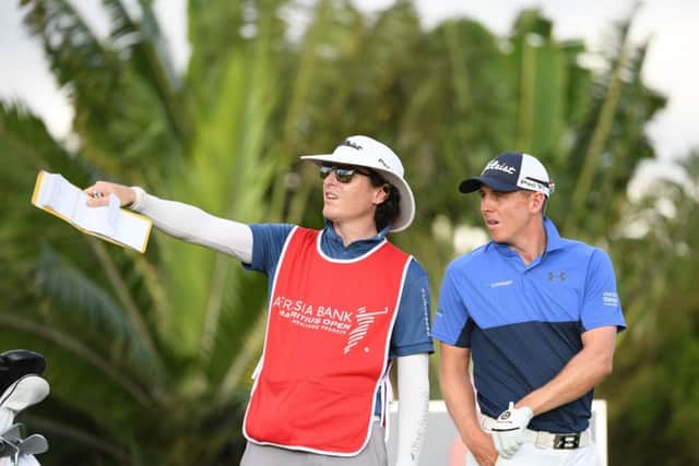 Grant Forrest and his caddie John McClure talk tactics during the first round of the AfrAsia Bank Mauritius Open. Picture: Getty Images