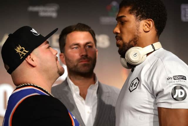 Promoter Eddie Hearn stands between Andy Ruiz Jr and Anthony Joshua ahead of their so-called Clash On The Dunes in Diriyah, Saudi Arabia. Picture: Richard Heathcote/Getty Images