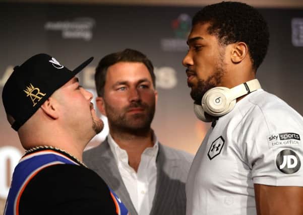 Promoter Eddie Hearn stands between Andy Ruiz Jr and Anthony Joshua ahead of their so-called Clash On The Dunes in Diriyah, Saudi Arabia. Picture: Richard Heathcote/Getty Images