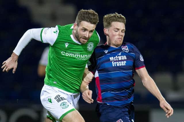 Jason Naismith battles with Ross County's Josh Mullin during Hibs' midweek defeat in Dingwall. Picture: Bruce White/SNS