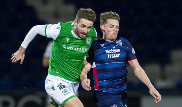 Jason Naismith battles with Ross County's Josh Mullin during Hibs' midweek defeat in Dingwall. Picture: Bruce White/SNS