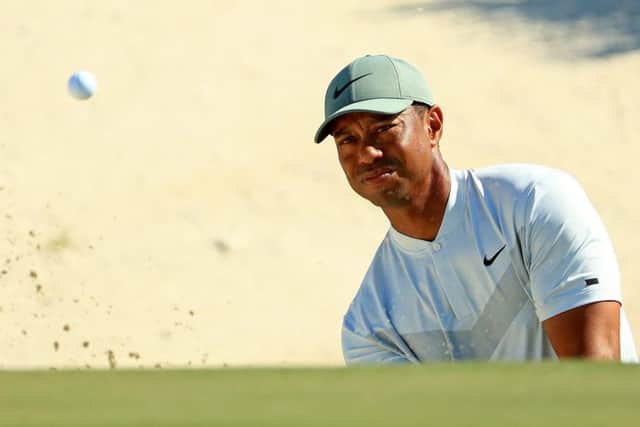 Tiger Woods plays a bunker shot on the third hole during the second round of the Hero World Challenge. Picture: Mike Ehrmann/Getty Images