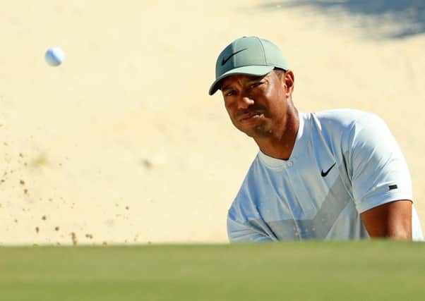Tiger Woods plays a bunker shot on the third hole during the second round of the Hero World Challenge. Picture: Mike Ehrmann/Getty Images