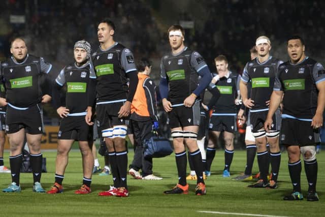 The Glasgow players are disconsolate at the end of their 23-10 Pro14 defeat by Leinster. Picture: Gary Hutchison/SNS