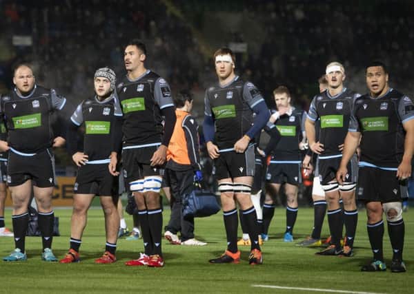 The Glasgow players are disconsolate at the end of their 23-10 Pro14 defeat by Leinster. Picture: Gary Hutchison/SNS