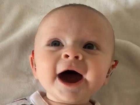 The moment Georgina heard her dad for the first time. Picture: SWNS