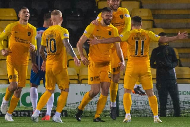 Livingston players celebrate Jon Guthrie's opener.