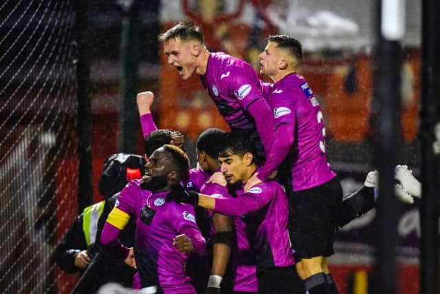 St Mirren players mob goalscorer Cammy MacPherson