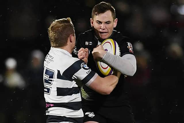 Heriots centre Cameron Hutchison stops Ciaran Whyte of the Southern Knights.  Photograph: John Devlin