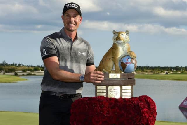 Sweden's Henrik Stenson poses with the trophy after winning the Hero World Challenge in Nassau. Picture: Dante Carrer/AP