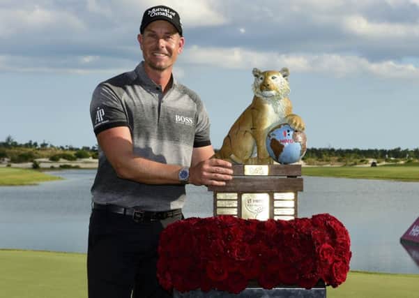 Sweden's Henrik Stenson poses with the trophy after winning the Hero World Challenge in Nassau. Picture: Dante Carrer/AP