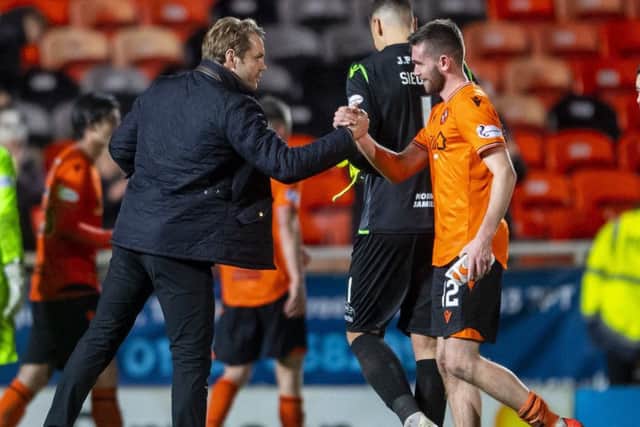 Dundee United manager Robbie Neilson with Sam Stanton at full time. Picture: Bill Murray / SNS