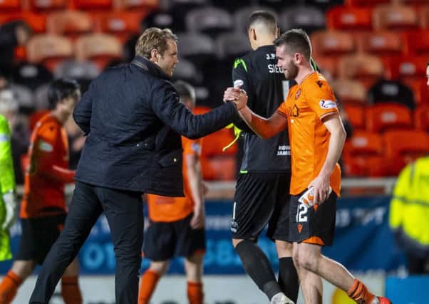 Dundee United manager Robbie Neilson with Sam Stanton at full time. Picture: Bill Murray / SNS