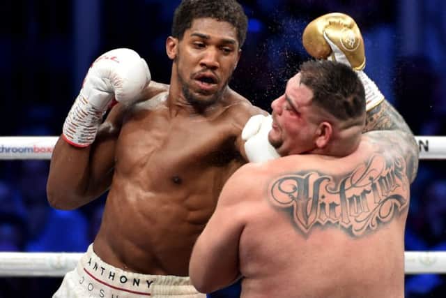 Anthony Joshua lands a left glove on Andy Ruiz Jr in Saudi Arabia. Picture: AFP/Getty