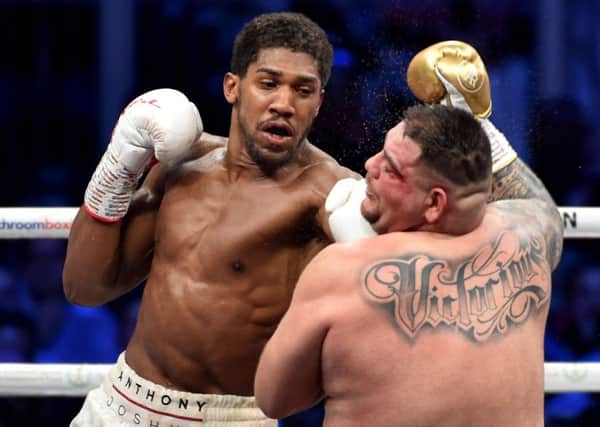 Anthony Joshua lands a left glove on Andy Ruiz Jr in Saudi Arabia. Picture: AFP/Getty