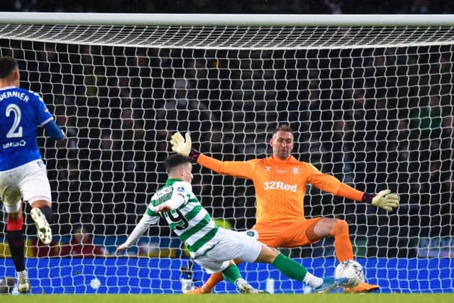 Mikey Johnston flashes a shot wide of the post after being sent through by Odsonne Edouard