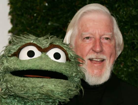 Caroll Spinney with his characters Oscar The Grouch. Picture: AP