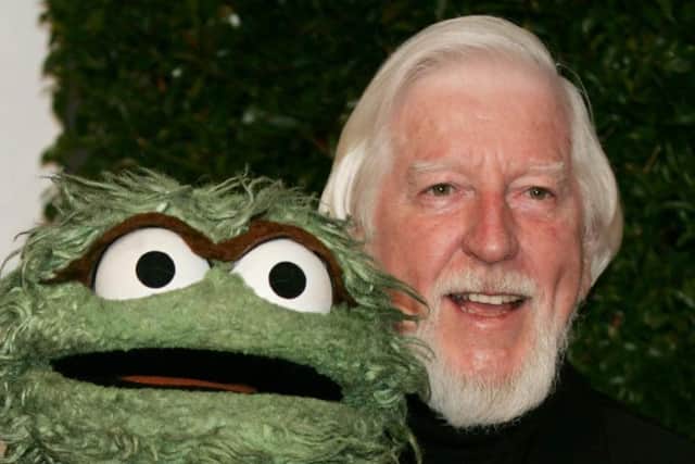 Caroll Spinney with Oscar The Grouch, another character he voiced. Picture: PA