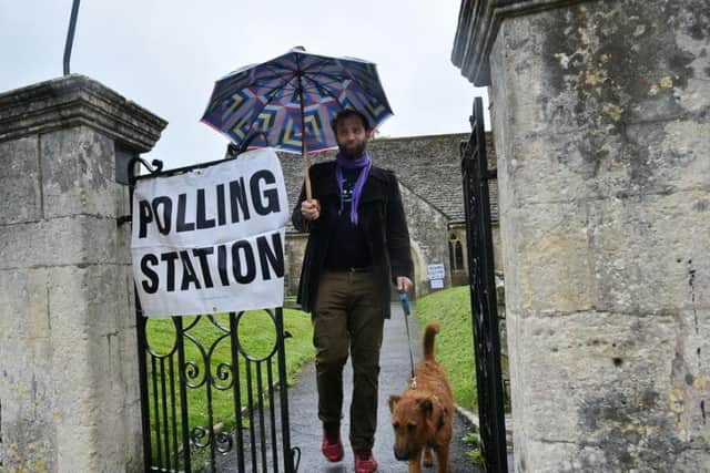 A voter leaves a polling station at a village church (Photo: Shutterstock)