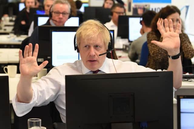 Prime Minister Boris Johnson with other members of the Cabinet at Conservative Campaign Headquarters Call Centre, London, while on the election campaign trail. Picture: PA