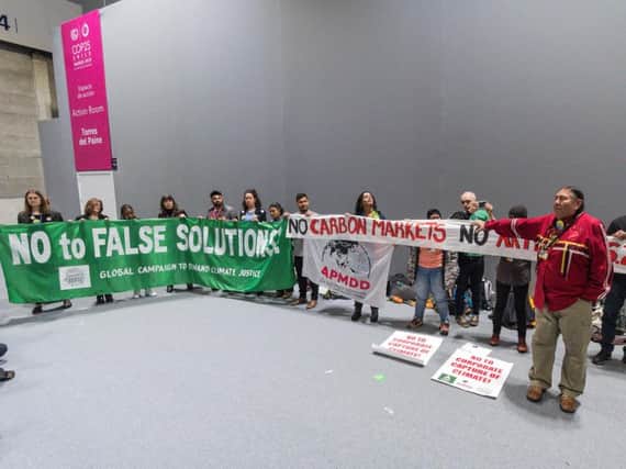 A protest at the Madrid climate summit against carbon markets (Stop Climate Choas)