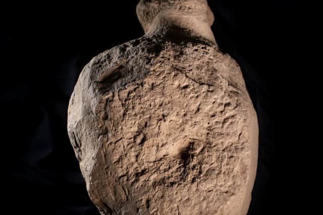 Three of the roughly carved figures were incorporated within the structure of one of the hearths and in the foundations of one of the standing stones. Picture: SWNS