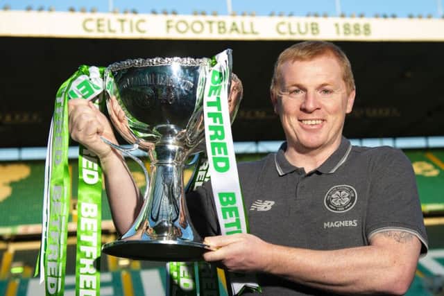 Neil Lennon was all smiles as he paraded the Betfred Cup trophy in front of the media at Parkhead.
