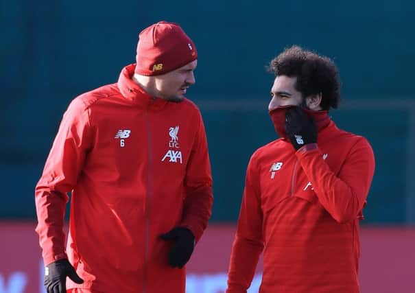 Dejan Lovren, left, and Mohamed Salah train at Melwood ahead of Liverpool's clash with RB Salzburg.  Picture: PA