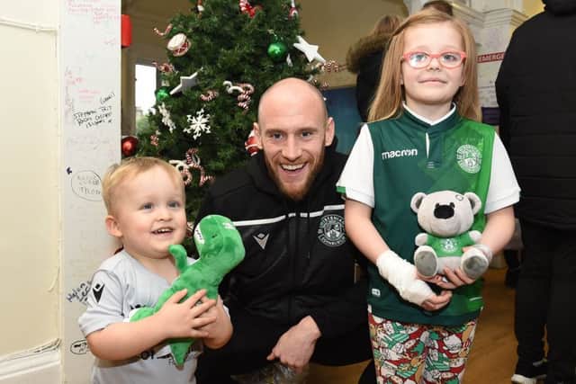 David Gray with Noah Kerr, left, and Cody Douglas during the Hibs squad's visit to the Royal Hospital for Sick Children in Edinburgh. Picture: Paul Devlin/SNS