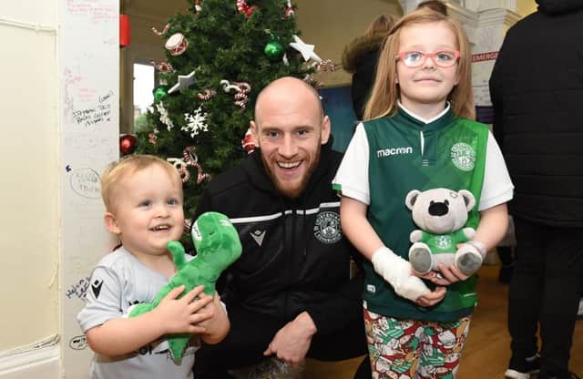 David Gray with Noah Kerr, left, and Cody Douglas during the Hibs squad's visit to the Royal Hospital for Sick Children in Edinburgh. Picture: Paul Devlin/SNS