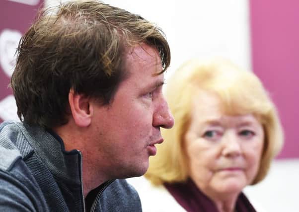 Daniel Stendel meets the press as Ann Budge looks on