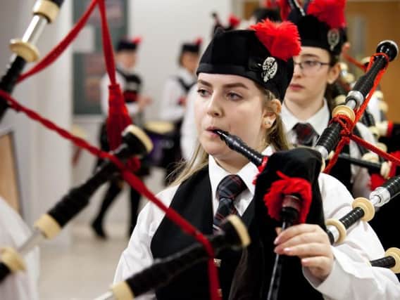A top piping honour will be named after Eilidh Macleod, who was killed in the 2017 Manchester Arena attack aged just 14. She is pictured here with her pipe band, Sgoil Lionacleit Pipe Band in Benbecula. PIC: Contributed.